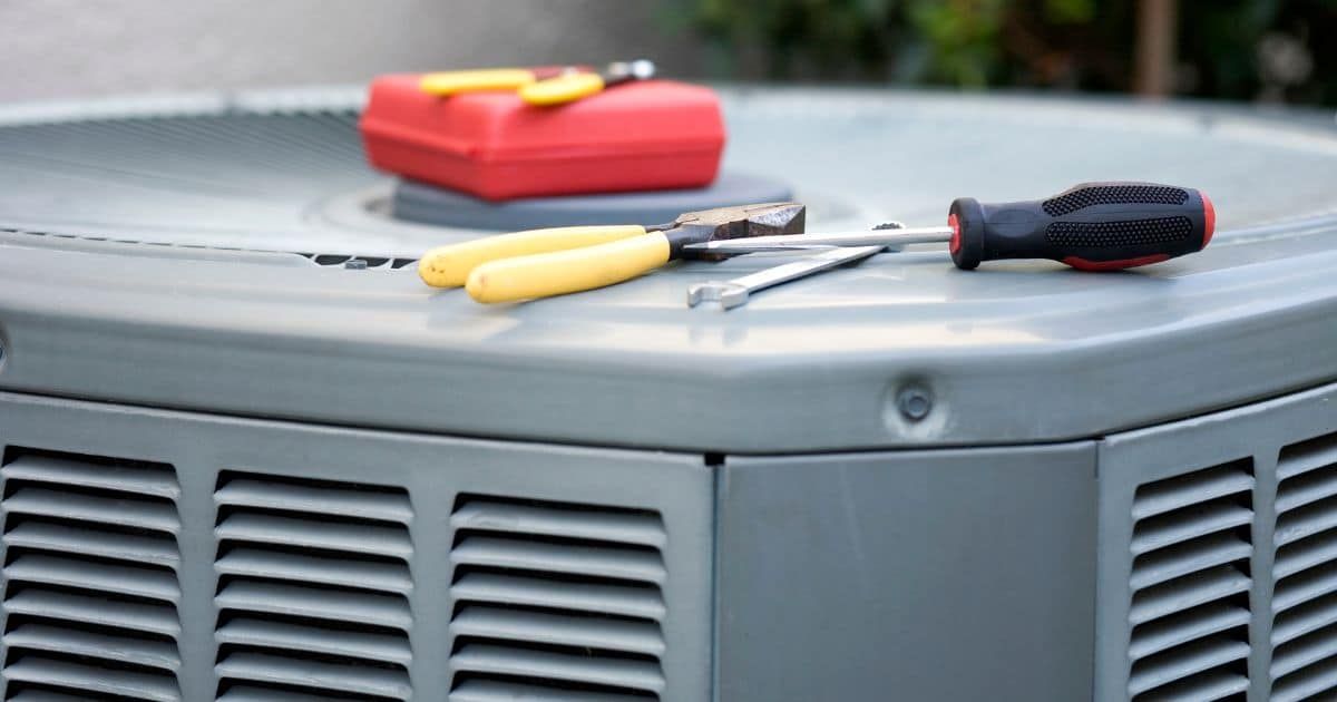 a close-up of tools on a air conditioner