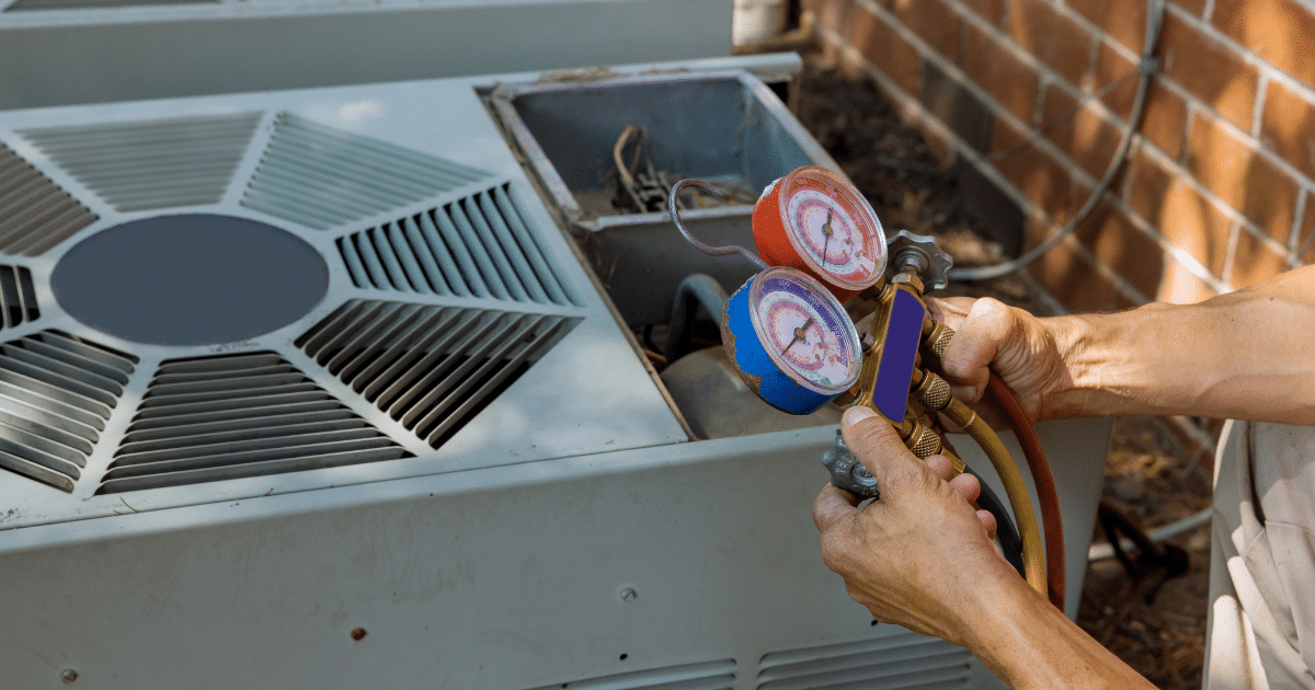 a person holding a pressure gauge